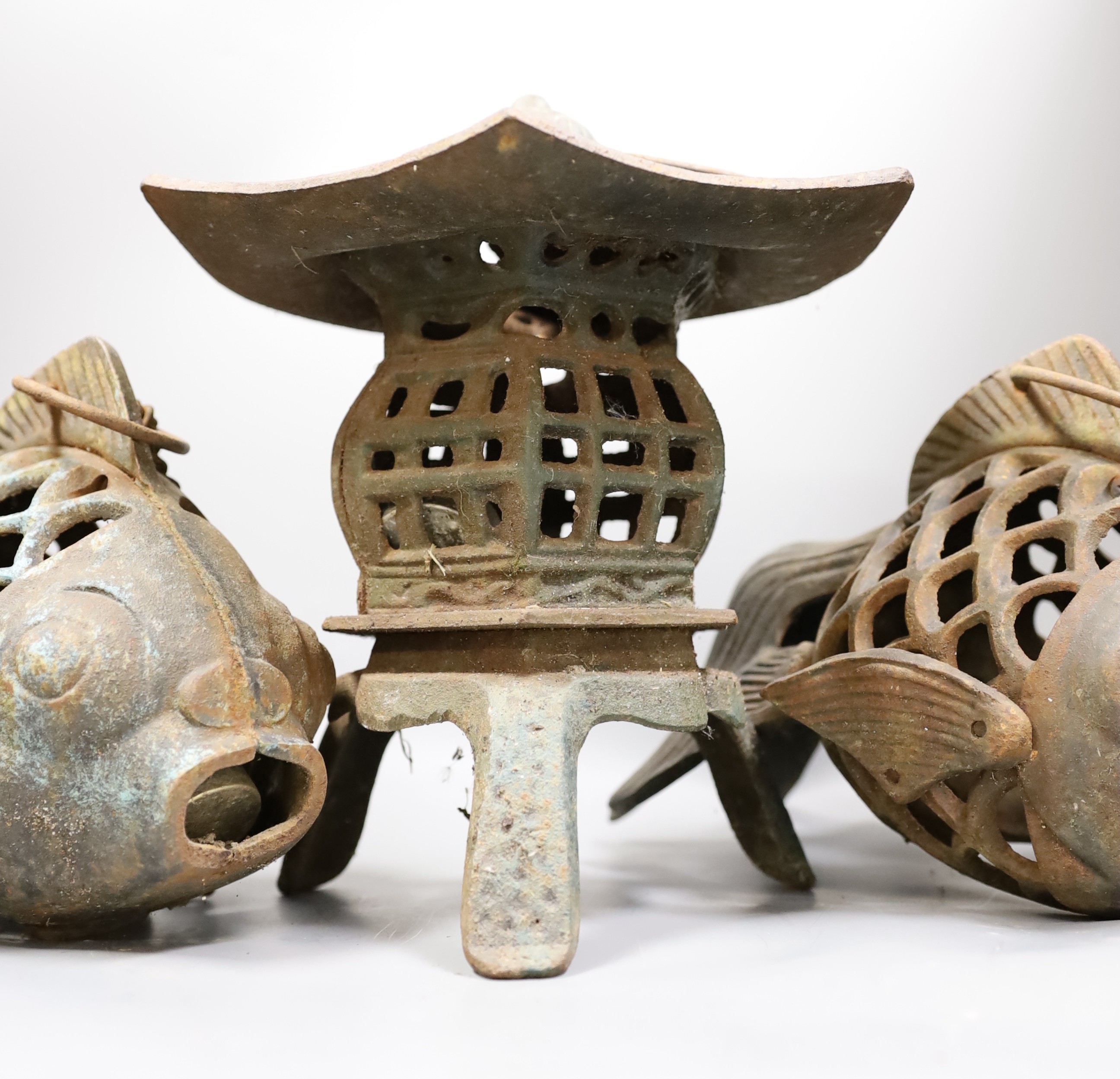 A Japanese iron lantern and two similar koi